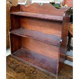 A small set of mahogany wall hanging shelves, waterfall fronted, 59cmW