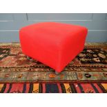 A red upholstered footstool, 54x54x37cmH