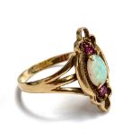 A 9ct gold ring set with opal and two small rubies, size R, 2.8g