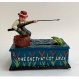 A cast metal novelty fishing 'The one that got away' money box