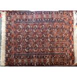 A small turkmen rug, 145x104cm; together with two prayer mats, 129x89cm and 130x78cm (3)