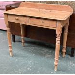 A pine desk/side table, galleried back with two frieze drawers, on turned legs, 89x44x72cm