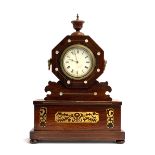 A oak cased octagonal mantel clock with mother of pearl and brass inlay, surmounted by finial,