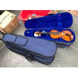 A lot of four Stentor half size violins, in carry case; together with a small Chinese student violin