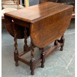 An oak flattened oval gateleg table, on barleytwist supports, 91x44x74cmH