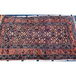 A rug with five lozenges and triple border, 220x125cm