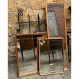 An oak framed wall mirror, 70x52cm, together with one other similar and a pine framed long mirror,