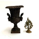 A cast bronze urn, 20cmH; together with a brass figure of monks, 11.5cmH