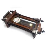 A mahogany cased wall clock, with pendulum and key, approx. 82cmH