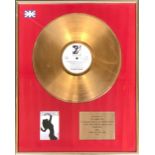 A gold LP, Technotronic 'Pump Up The Jam', in presentation frame with plaque