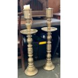 A pair of very large and heavy cathedral style brass candle holders, each 96cmH