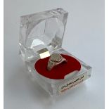 An Eastern white metal and quartz ring in plastic faceted presentation box