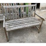 A slatted wooden garden bench, 108cmW