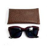 A pair of Christian Dior ladies sunglasses, with pouch