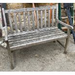A slatted wooden garden bench, 108cmW