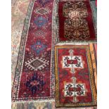 A Persian runner rug, 215x57cm; together with two other small rugs, 110x70cm and 90x56cm