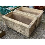 A pair of composite stone trough planters, each 57cmW