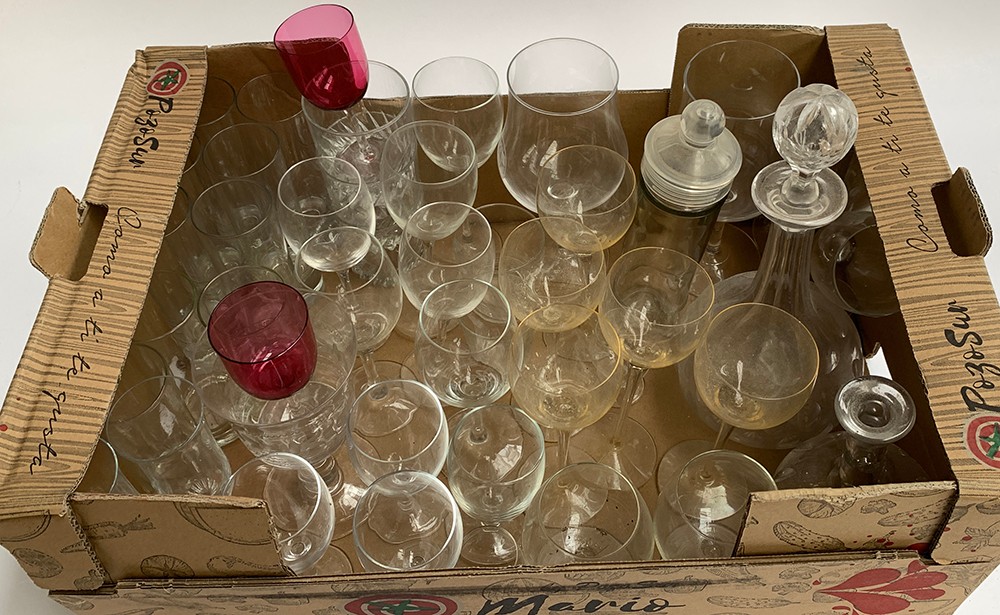 A mixed lot of glassware, mostly stem wine glasses and tall drinking glasses