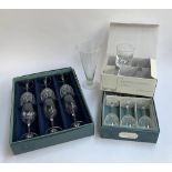 Two boxed sets each of six cut glass wine glasses by JG Durand; together with a boxed set of five