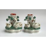 A pair of Staffordshire encrusted swan spill vases, each approx. 11cmH