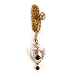 An Edwardian Art Nouveau style lavalier pendant, yellow metal set with a seed pearl and rubies,