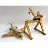 A Playmobil passenger jet, together with a freight crane