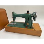 An Alfa sewing machine, in carry case, no. A53256