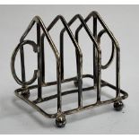 A small silver three division toast rack, hallmarked Birmingham, 1922