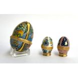 Three Halcyon days egg shaped trinket boxes, one large with two smaller