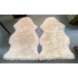 A pair of Soak & Sleep white sheepskin rugs, each 100cmL