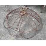A pair of wrought iron garden ornaments, possibly hanging baskets, each 95cmD