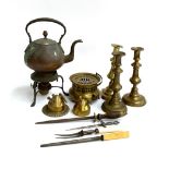 A copper kettle on stand with burner; three brass candle sticks; trench art; further brass burner