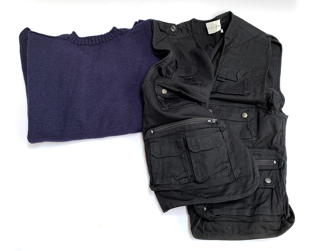 An unworn navy Guernsey jumper, 48" chest; together with a black cotton fishing gilet (2)