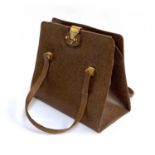 A 1950s brown leather handbag (damage to one strap)