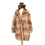 A ladies rabbit fur coat by Regency; together with a hat with velvet rosette; and one other