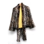 An M. Camozzi faux leopard skin trouser suit, with wool lining, the trousers with zipped ankles;