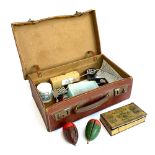 A brown leather overnight case containing a quantity of vintage fly tying equipment, in particular a