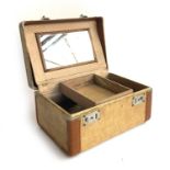 A canvas and leather vanity case, 33x23x17cm