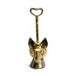 A 19th century brass and iron fox mask doorstop, with twist design handles on horse hoof bases, 36cm