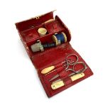 A Frank Smythson of New Bond Street red leather pocket sewing kit, fitted with contents