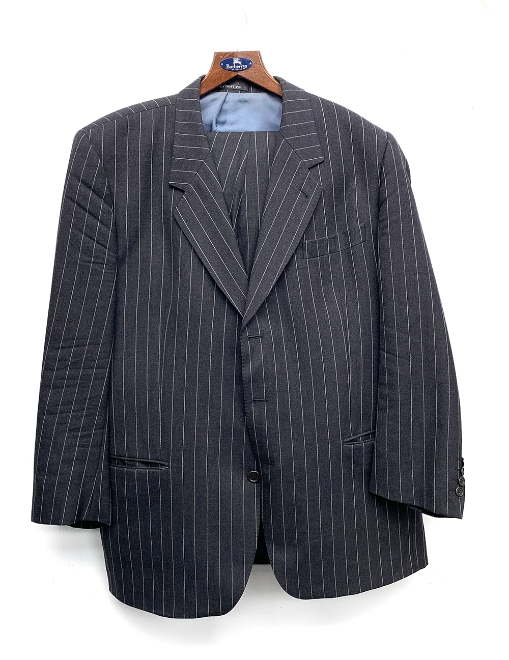 A Burberry's grey wool pinstripe suit with two pairs of trousers and Burberry hanger, 44" chest