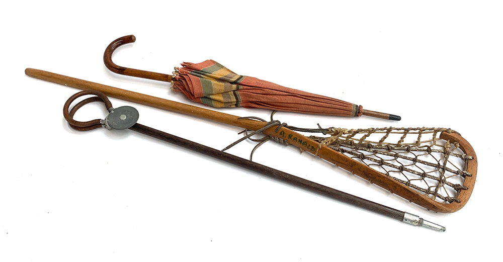 A vintage lacrosse stick, shooting stick, and umbrella (3)