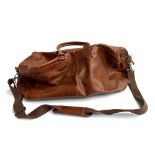 A brown leather duffel bag with interior pockets and shoulder strap
