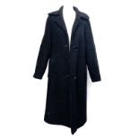 A vintage black lambswool overcoat with quilted lining, approx. size 10; together with a 1970s