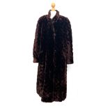 A long brown fur coat, quilted