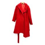 A ladies red overcoat, approx. size 14; together with a further tweed overcoat with velvet collar,