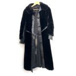 A black leather and fur coat, approx. size 8-10