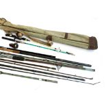 A mixed lot of sea and coarse fishing rods, together with various vintage reels, and a gun