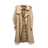 A Burberry's double breasted raincoat with nova check lining, 48" chest