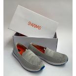 A pair of new Swims shoes, size 9